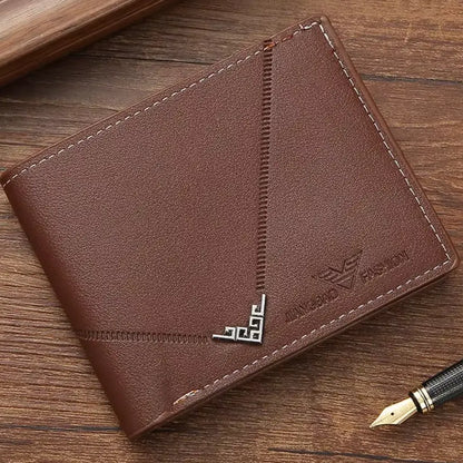 Angled view of the closed brown Arlen slim wallet on a wooden surface.
