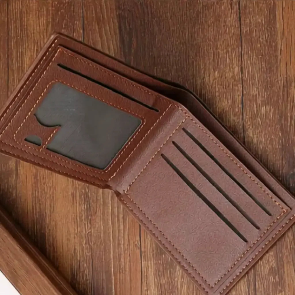 Open brown slim wallet showing card slots and an ID window.