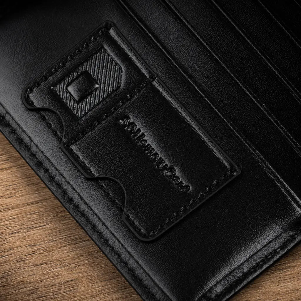 Close-up of black Wallet for Men RFID Model Bravik by CORVIKO showing interior card slots, stitching and smooth PU leather texture.