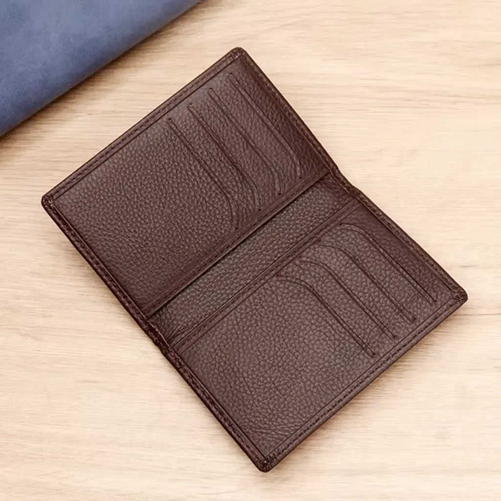Coffee leather card holder for men opened to show multiple card slots and interior organization
