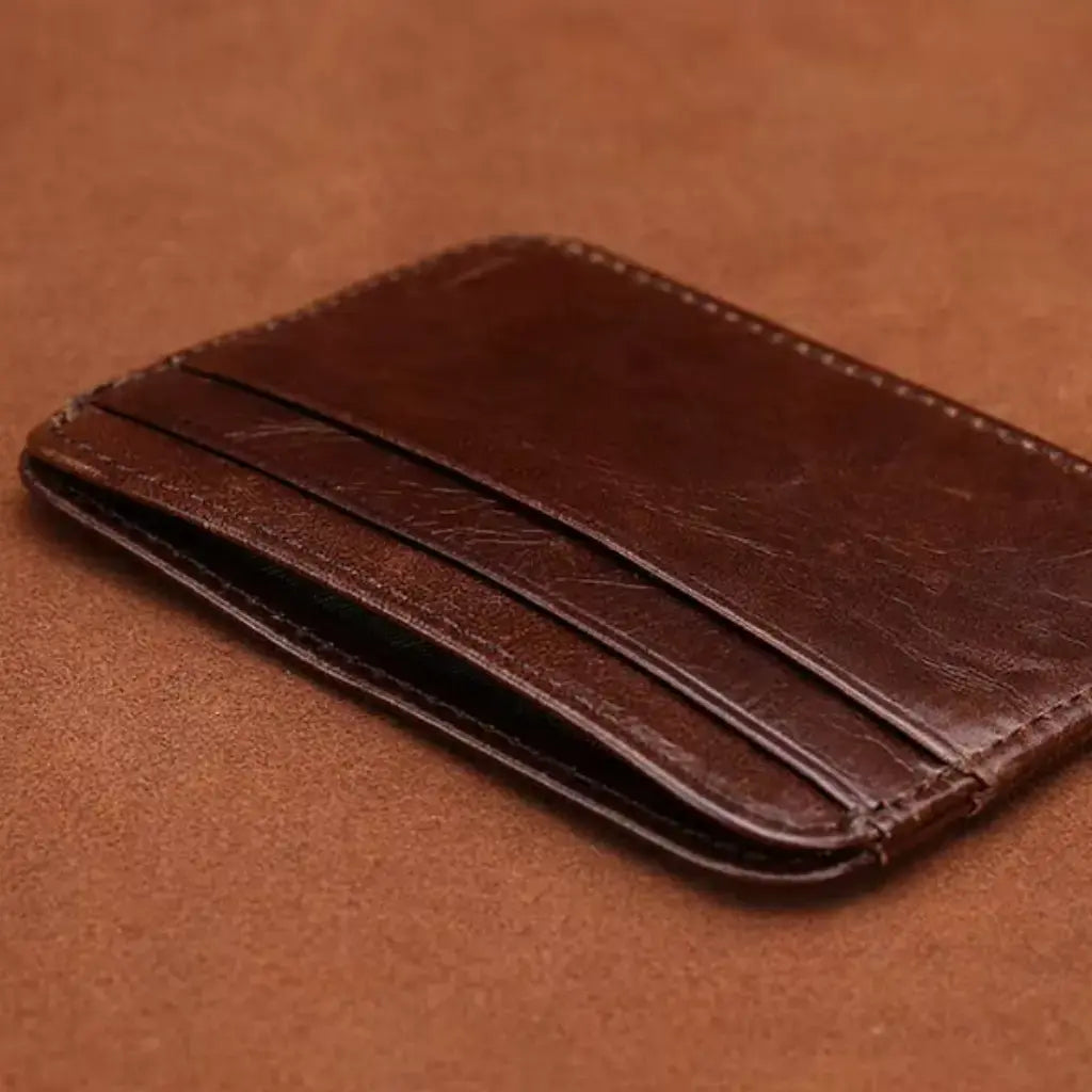 Slim brown vintage leather card holder for men with visible card slots and compact profile