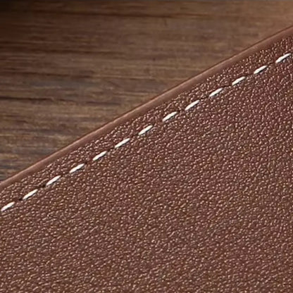 Close-up of the wallet’s textured brown surface and diagonal stitched design.